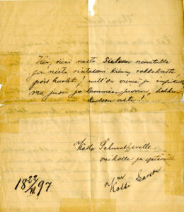Käsinkirjoitettu kirje, jonka paperi on kellastunut. Paperin vasemmassa alanurkassa päiväys 22.11.1897.
